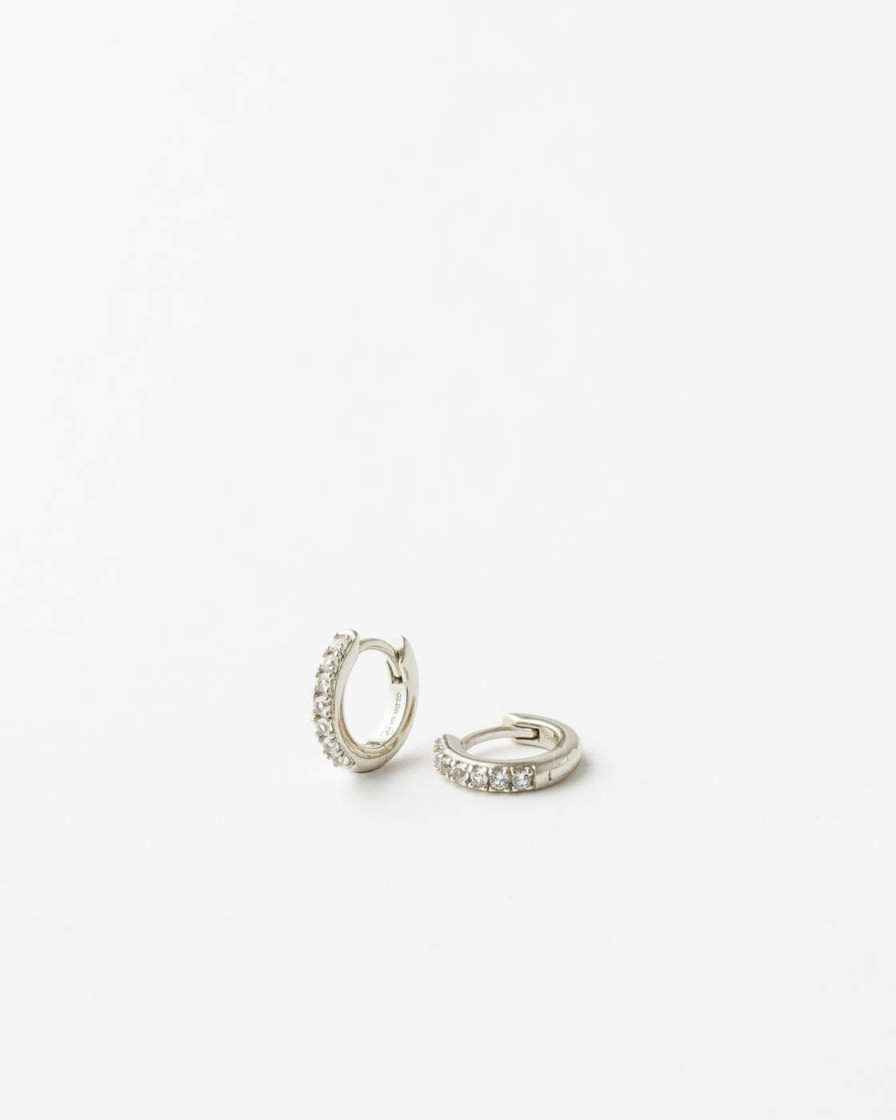 Categories GLDN | Olivia White Sapphire Huggie Hoops